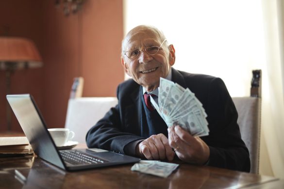 Elderly man holding money