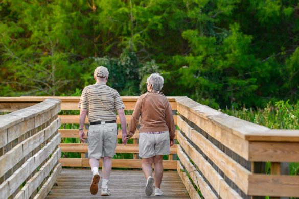 Senior couple walking on a boardwalk